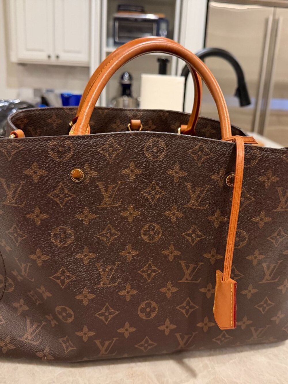 Great brown monogram satchel with fabulous designer detail